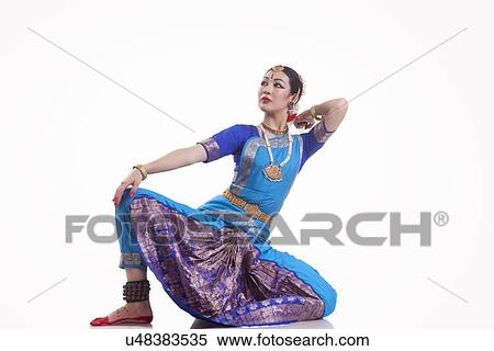 Full length of dancer performing Bharatanatyam against white background View Large Photo Image Stock Photography - Full length of dancer performing Bharatanatyam against white background. Fotosearch