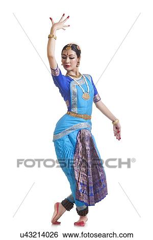 Full length of female Bharata Natyam performer over white background View Large Photo Image Stock Photograph - Full length of female Bharata Natyam performer over white background. Fotosearch