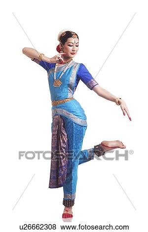 Full length of female classical dancer performing Bharatanatyam on white background View Large Photo Image Stock Photo - Full length of female classical dancer performing Bharatanatyam on white background. Fotosearch