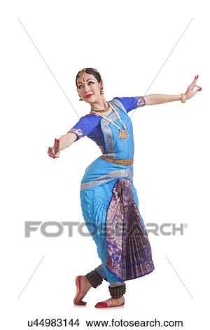 Full length of female dancer performing Bharatanatyam against white background View Large Photo Image Picture - Full length of female dancer performing Bharatanatyam against white background. Fotosearch