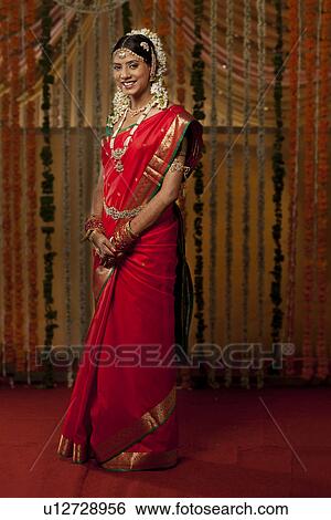 Full length of Indian bride smiling View Large Photo Image Stock Photograph - Full length of Indian bride smiling . Fotosearch