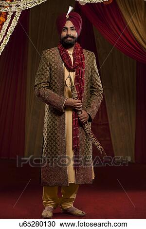 Full length of well dressed man with turban View Large Photo Image Stock Image - Full length of well dressed man with turban . Fotosearch