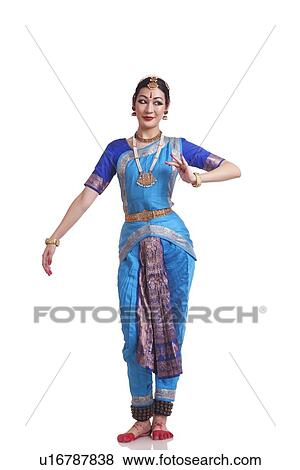 Stock Photo - Full length of Woman performing traditional Bharat Natyam dance on white background. Fotosearch