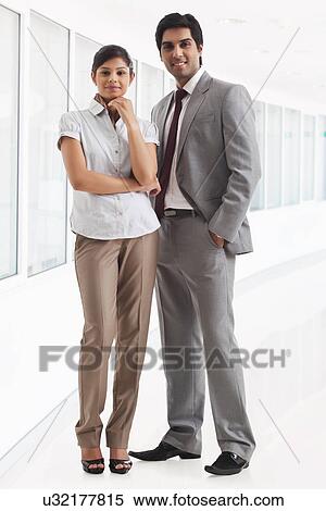 Full length of young business people standing in lobby View Large Photo Image Stock Photography - Full length of young business people standing in lobby . Fotosearch