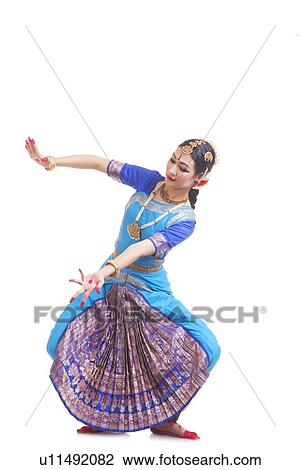 Full length of young woman performing Bharatanatyam over white background View Large Photo Image Stock Image - Full length of young woman performing Bharatanatyam over white background. Fotosearch