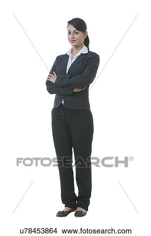 Picture - Full length portrait of well-dressed businesswoman against white background. Fotosearch