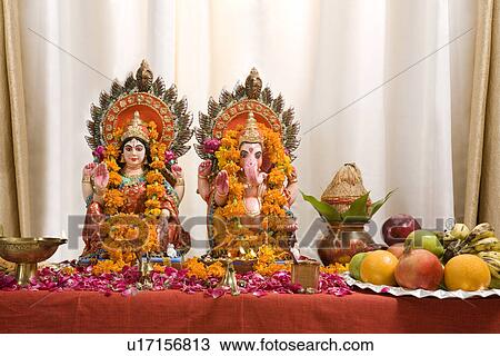 Stock Image - Ganesh and Lakshmi idols . Fotosearch