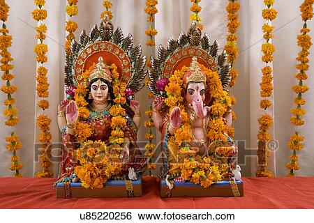 Ganesh and Lakshmi idols View Large Photo Image Stock Photograph - Ganesh and Lakshmi idols . Fotosearch