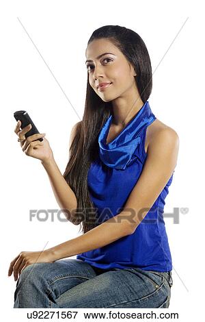 Girl holding a mobile phone View Large Photo Image Stock Photo - Girl holding a mobile phone . Fotosearch