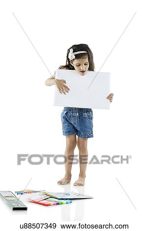 Girl holding a white board View Large Photo Image Stock Photo - Girl holding a white board . Fotosearch