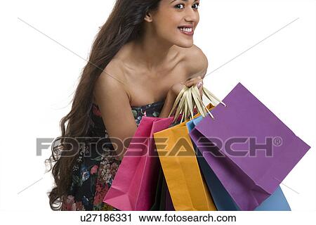 Girl holding shopping bags View Large Photo Image Stock Image - Girl holding shopping bags . Fotosearch