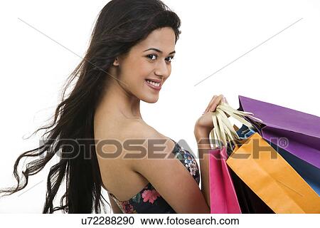 Girl holding shopping bags View Large Photo Image Stock Image - Girl holding shopping bags . Fotosearch