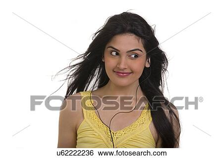 Stock Photograph - Girl listening to music . Fotosearch