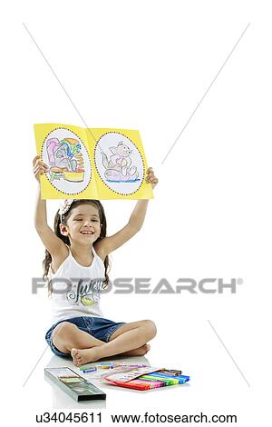 Girl showing her drawings View Large Photo Image Stock Image - Girl showing her drawings . Fotosearch