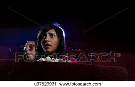 Girl watching a movie View Large Photo Image Stock Image - Girl watching a movie . Fotosearch