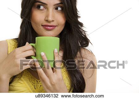 Stock Image - Girl with a cup of coffee . Fotosearch
