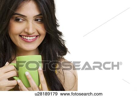 Girl with a cup of coffee View Large Photo Image Stock Photo - Girl with a cup of coffee . Fotosearch