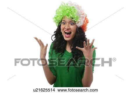 Picture - Girl with a wig cheering . Fotosearch