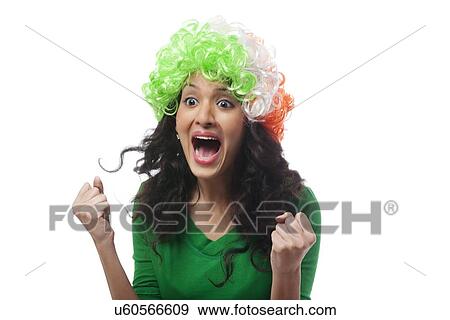 Stock Photo - Girl with a wig cheering . Fotosearch