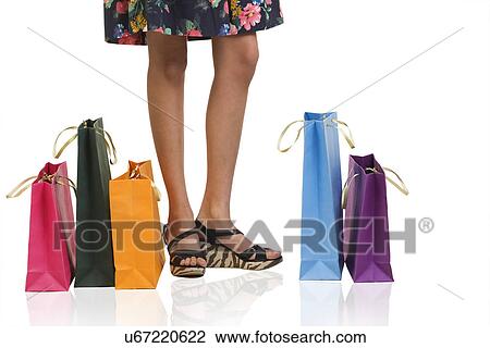 Stock Image - Girl with shopping bags . Fotosearch