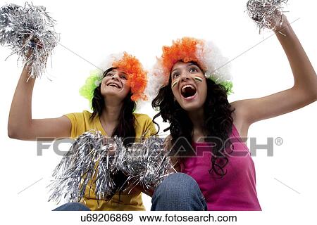 Girls with wigs cheering View Large Photo Image Stock Photo - Girls with wigs cheering . Fotosearch