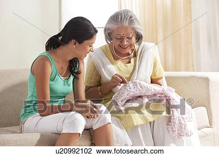 Grandmother teaching granddaughter how to sew View Large Photo Image Stock Image - Grandmother teaching granddaughter how to sew. Fotosearch