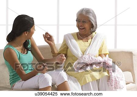 Grandmother teaching granddaughter how to sew View Large Photo Image Stock Photography - Grandmother teaching granddaughter how to sew. Fotosearch