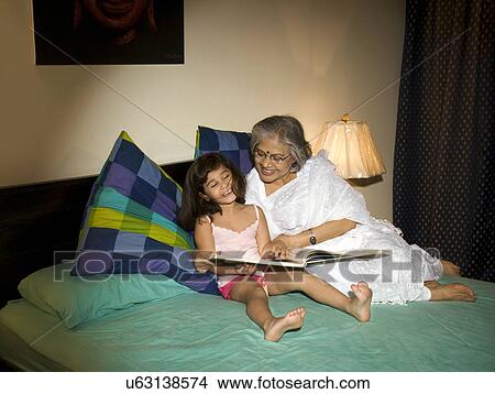 Grandmother with her granddaughter View Large Photo Image Picture - Grandmother with her granddaughter . Fotosearch