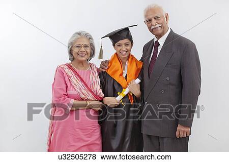 Stock Photo - Grandparents at granddaughter's graduation ceremony. Fotosearch