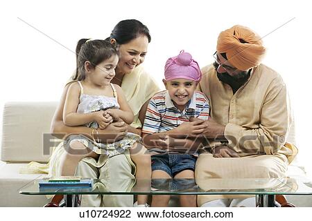 Stock Image - Grandparents spending time with their grand kids . Fotosearch
