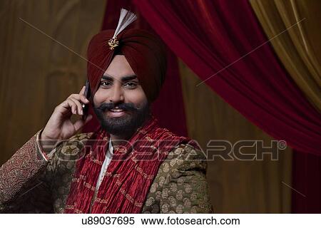 Groom having conversation on mobile phone View Large Photo Image Stock Photography - Groom having conversation on mobile phone . Fotosearch