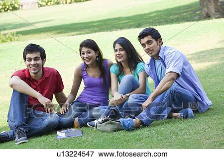Group of friends sitting in lawn View Large Photo Image Stock Photo - Group of friends sitting in lawn . Fotosearch