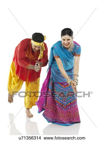 Gujarati couple dancing View Large Photo Image Picture - Gujarati couple dancing . Fotosearch