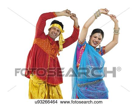 Picture - Gujarati couple dancing . Fotosearch