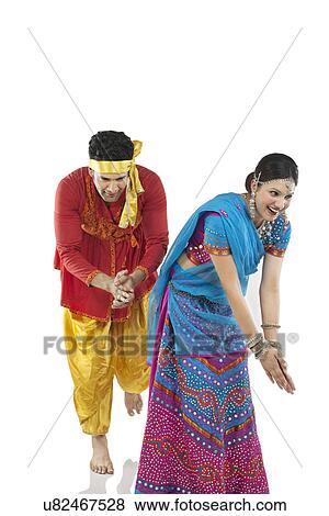 Stock Photo - Gujarati couple dancing . Fotosearch
