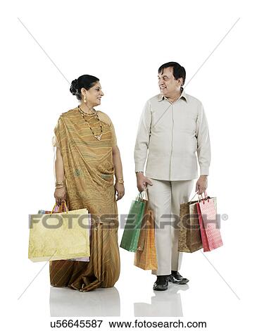 Gujarati couple with shopping bags View Large Photo Image Stock Photo - Gujarati couple with shopping bags . Fotosearch