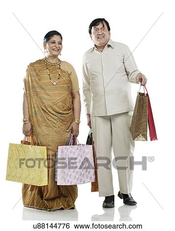 Gujarati couple with shopping bags View Large Photo Image Stock Photograph - Gujarati couple with shopping bags . Fotosearch