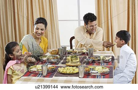 Gujarati family having lunch View Large Photo Image Picture - Gujarati family having lunch . Fotosearch