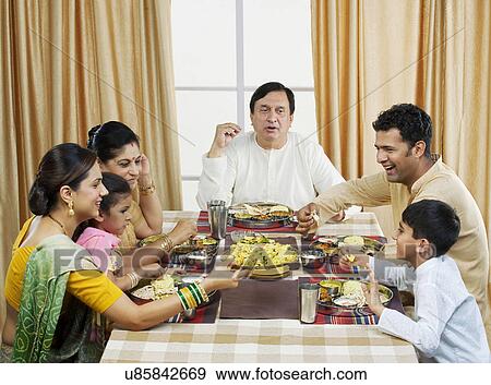 Gujarati family having lunch View Large Photo Image Stock Photo - Gujarati family having lunch . Fotosearch