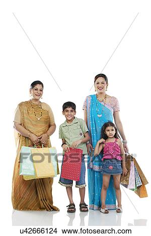 Picture - Gujarati family with shopping bags . Fotosearch