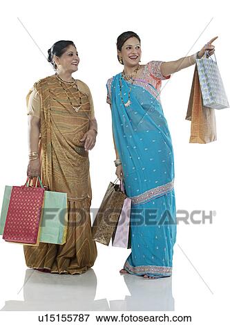 Stock Photo - Gujarati mother and daughter with shopping bags . Fotosearch