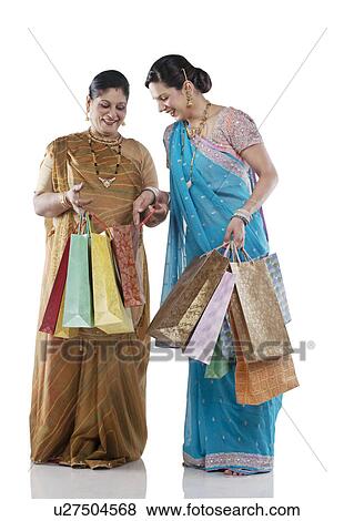 Gujarati mother and daughter with shopping bags View Large Photo Image Stock Photo - Gujarati mother and daughter with shopping bags . Fotosearch