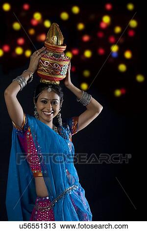 Gujarati woman holding a kalash View Large Photo Image Stock Image - Gujarati woman holding a kalash . Fotosearch