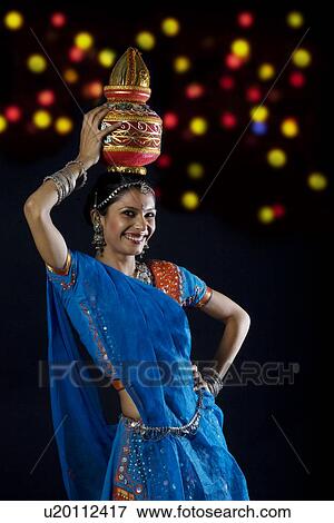 Stock Photo - Gujarati woman holding a kalash . Fotosearch