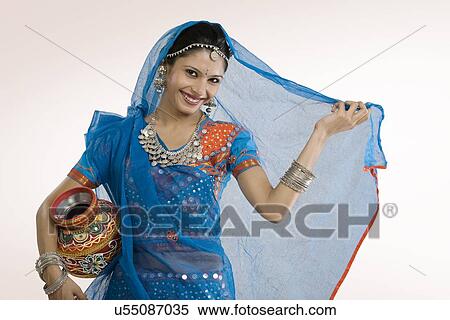 Gujarati woman holding a matka View Large Photo Image Stock Photography - Gujarati woman holding a matka . Fotosearch