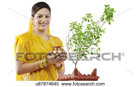 Stock Photography - Gujarati woman performing a ritual . Fotosearch