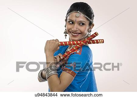 Gujarati woman performing dandiya View Large Photo Image Picture - Gujarati woman performing dandiya . Fotosearch