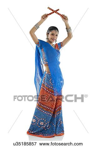 Gujarati woman performing dandiya View Large Photo Image Stock Photo - Gujarati woman performing dandiya . Fotosearch