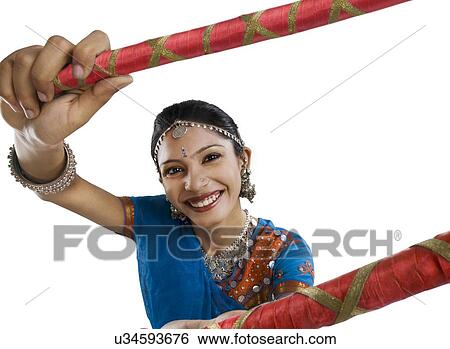 Gujarati woman performing dandiya View Large Photo Image Stock Photograph - Gujarati woman performing dandiya . Fotosearch