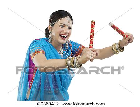 Gujarati woman with dandiya sticks View Large Photo Image Stock Image - Gujarati woman with dandiya sticks . Fotosearch